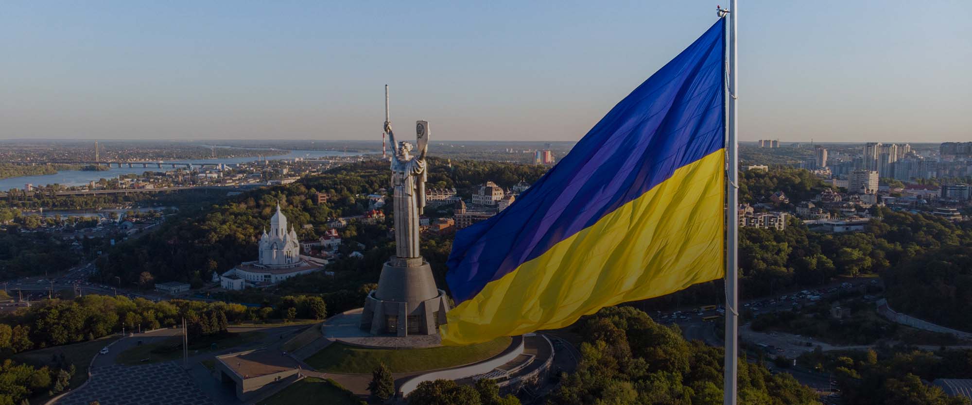 Ukraine flag in front of Motherland Monument